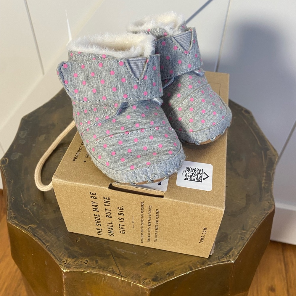 Tom’s pink polka dot booties. Never worn